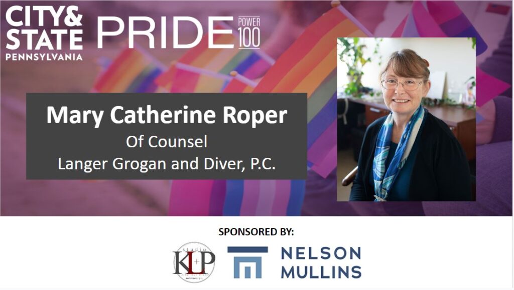 Image of Mary Catherine Roper, of Counsel, Langer Grogan and Diver, P.C. on background of many Pride flags. Image provided by City & State PA Magazine for the 2023 Pride Power 100 List.